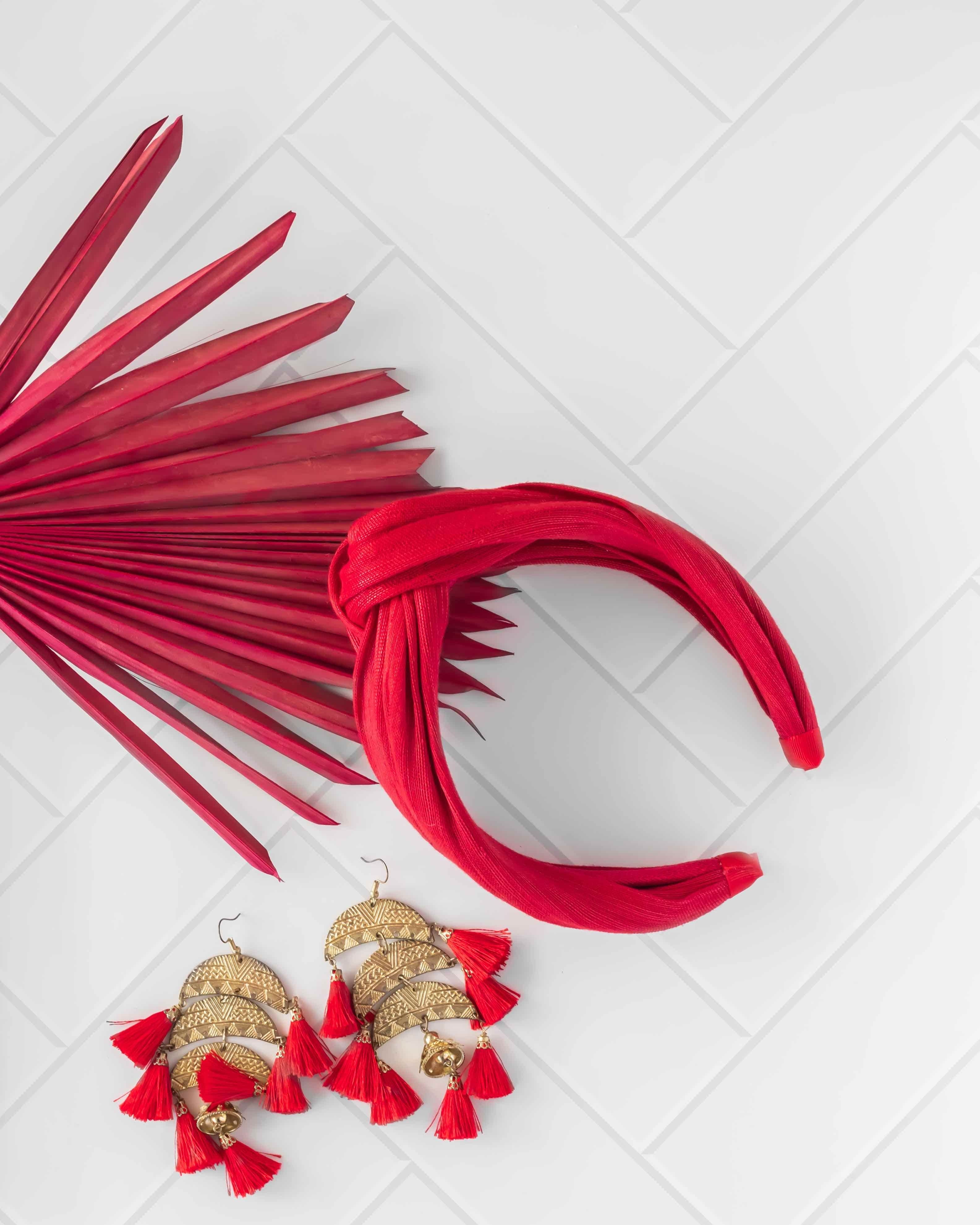 Herringbone white tile vinyl photography backdrop photographed hair accessories and earrings red - backdrop collective australia